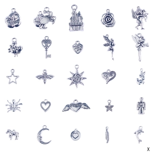 Detail view of 25 silver alloy ocean themed charms for children's DIY bracelet kits