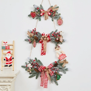 Three-tier Christmas stair swag with green pine, Santa dolls, and red polka dot bows