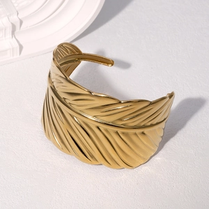 Adjustable gold stainless steel open bangle with intricate feather texture and 18k plating