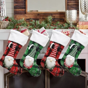 Set of 4 Christmas stockings with gnome appliques hanging on a festive mantelpiece