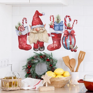 Christmas wall decals with Santa and candy canes on a cozy kitchen tile background