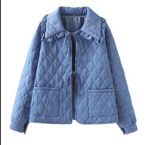 Blue quilted jacket with diamond pattern, ruffled collar and stylish bow tie closure