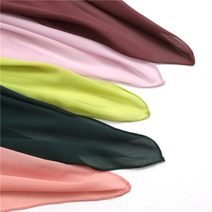 Close-up of lightweight chiffon scarves showing premium hem edges and soft fabric texture