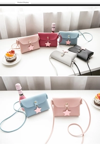 Detailed view of mini star-pendant crossbody bags in assorted colors and lychee grain leather