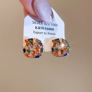 Macro shot of 925 silver square earrings featuring vibrant colorful zircon stones
