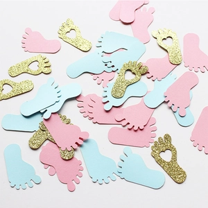 Pink, blue, and gold glitter baby foot confetti for gender reveal party table decoration