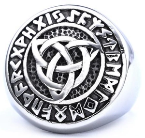 Macro detail of Nordic Viking ring showing Celtic knot and Rune alphabet engraving
