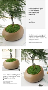 Detailed close-up of artificial moss and dense foliage in a pebble-shaped ceramic pot