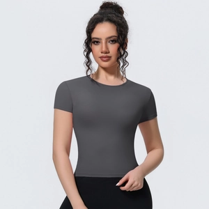 Detail view of the stretchable dark grey fabric and seamless waist on yoga t-shirt