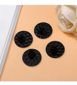 Set of four black round enamel pins with 3D geometric cube pattern and butterfly clasps