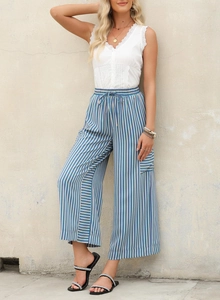 Detail of high-waisted drawstring and vertical stripes on casual wide-leg trousers