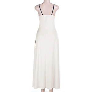 Detail of beige backless maxi dress with contrasting thin black spaghetti straps