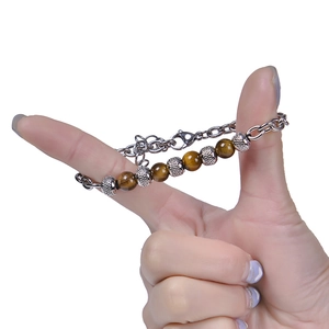 Handheld natural tiger eye beaded bracelet with silver metal charms and adjustable clasp