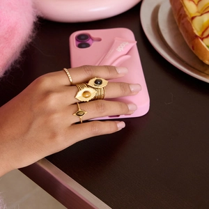 Detail of 18K gold-plated oval Tiger Eye and Evil Eye open rings set for women
