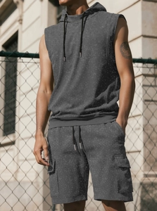 Detail of dark grey acid wash gym hoodie and cargo shorts with side pocket texture