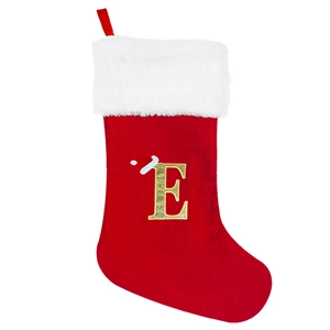 Detail of red velvet Christmas stocking featuring a gold glitter embroidered letter E