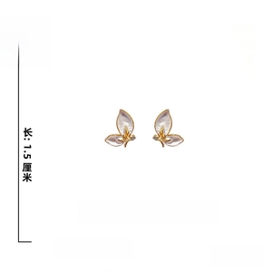 Detail of butterfly earrings with 925 silver needle, rhinestones and enamel wings