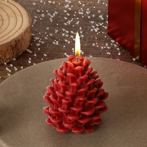 Deep red pinecone scented candle with realistic scale texture for Christmas decor