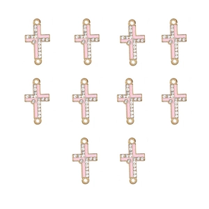 Detailed view of ten pink enamel gold-tone cross connectors with sparkling rhinestones