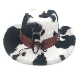 Detail of western cow print cowboy hat with turquoise embroidered faux leather band