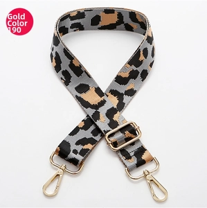 Detail of adjustable leopard print bag strap with high-quality gold metal hooks