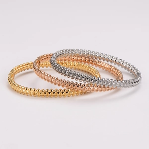 Three-color stainless steel rivet bangles in gold, rose gold and silver finish