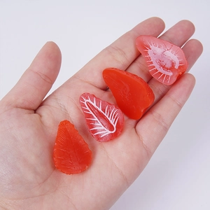 Set of four realistic miniature resin strawberry slices for DIY crafts and decor