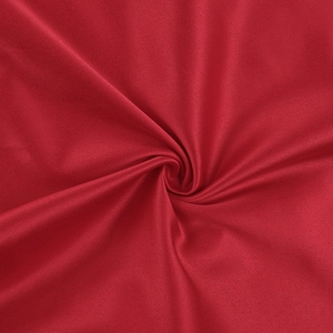 Detailed close-up of dark red satin fabric showing smooth texture and elegant drapes
