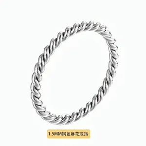 Macro detail of a 1.5mm steel twisted ring with minimalist rope texture finish