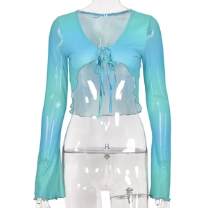 Detail of the sheer gradient blue mesh tie-front crop top with long sleeves and light fabric