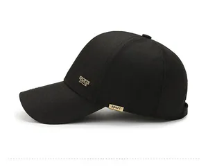 Close-up of black baseball cap side with gold Sports Style metal plaque and fine stitching