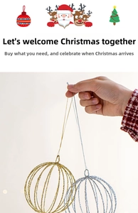 Detail of hollow iron Christmas ball ornaments in gold and silver with metal wire patterns