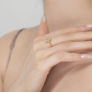 Close-up of a S925 sterling silver ring with a radiant emerald-cut sparkling gemstone