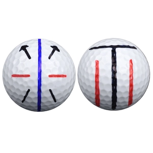 Golf ball liner tool with white golf balls featuring blue, red, and black alignment lines