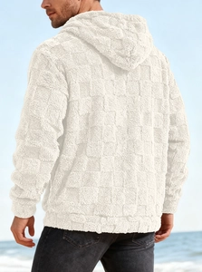 Macro shot of men's cream fleece hoodie showing textured grid pattern and embroidery detail