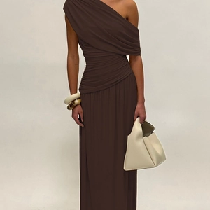 Detail view of dark brown asymmetric ruched maxi dress with elegant draped fabric
