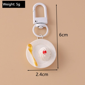 Detailed view of creative mini dessert keychain with size specs on a beige background
