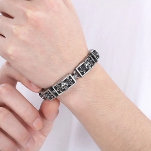 Detail of vintage gothic skull bracelet for men showing retro engraved metal texture