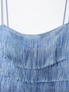 Detail of blue metallic fringe dress showing layered tassels and thin shoulder straps