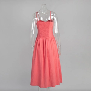 Detail of coral cotton dress with smocking back and adjustable spaghetti straps