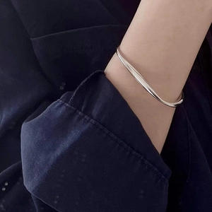 Minimalist 925 sterling silver open bangle with sleek irregular curved streamline design