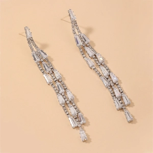 Macro shot of silver-tone tassel earrings with cubic zirconia fringe detailing