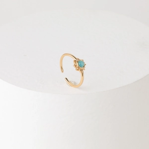 Vintage 14k gold plated brass sunburst ring featuring a round blue gemstone inlay