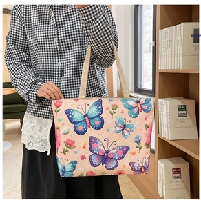 Close-up of bohemian floral canvas tote bag with butterfly prints and hemp rope handles