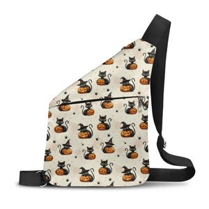 Detail of Halloween pumpkin and black cat patterns on a beige crossbody sling bag