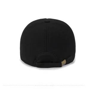 Detailed back view of a black wool baseball cap with an adjustable bronze metal buckle