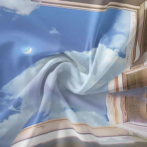 Close-up of bohemian wall tapestry fabric showing soft silky texture and scenic window print