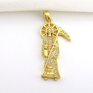 Golden Santa Muerte pendant with sparkling cubic zirconia on white silk background
