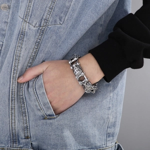 Retro lion head titanium steel biker bracelet with heavy chunky chain on model wrist