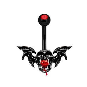 Macro detail of gothic bat skull belly ring with heart shaped red rhinestones